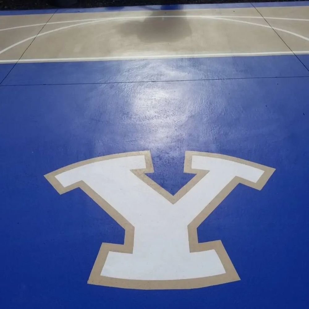 Blue epoxy floor with custom logo